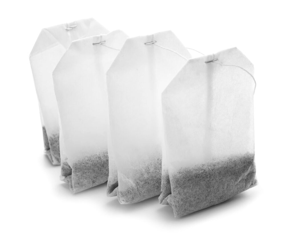 Tea bags on white background