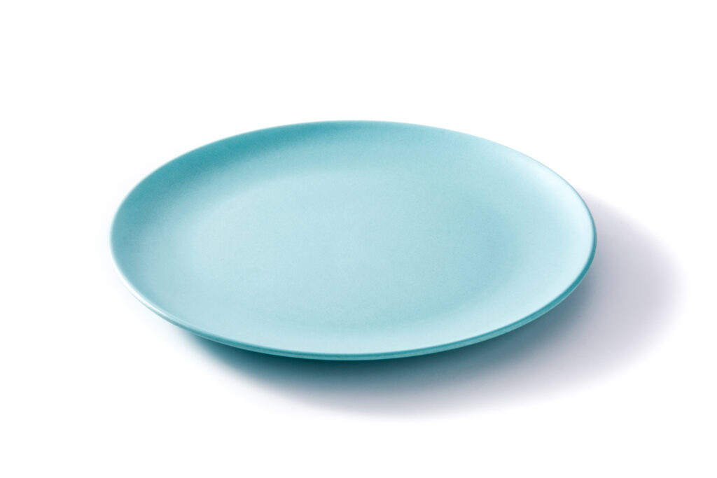 Empty blue plate on white background