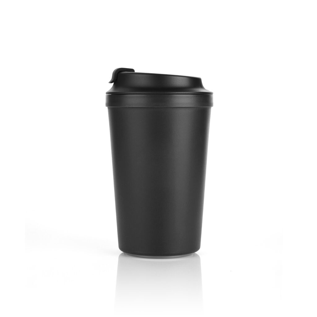 Blank Classic black colour anti slip suction coffee mug isolated on white background. Front view with reflection. Suitable for hot & cold beverage. For branding, mock up & advertisement. Studio Shoot.